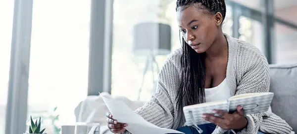 Woman trying to figure out how to pay for college with private student loans and scholarships